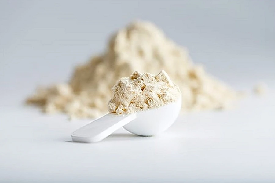 yeast protein powder in a white spoon
